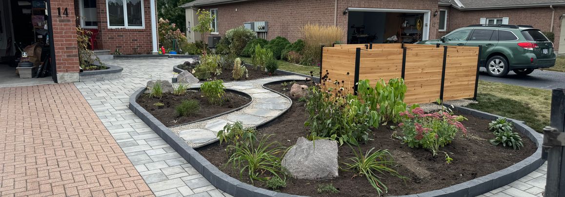 Front yard with stone work and landscaping