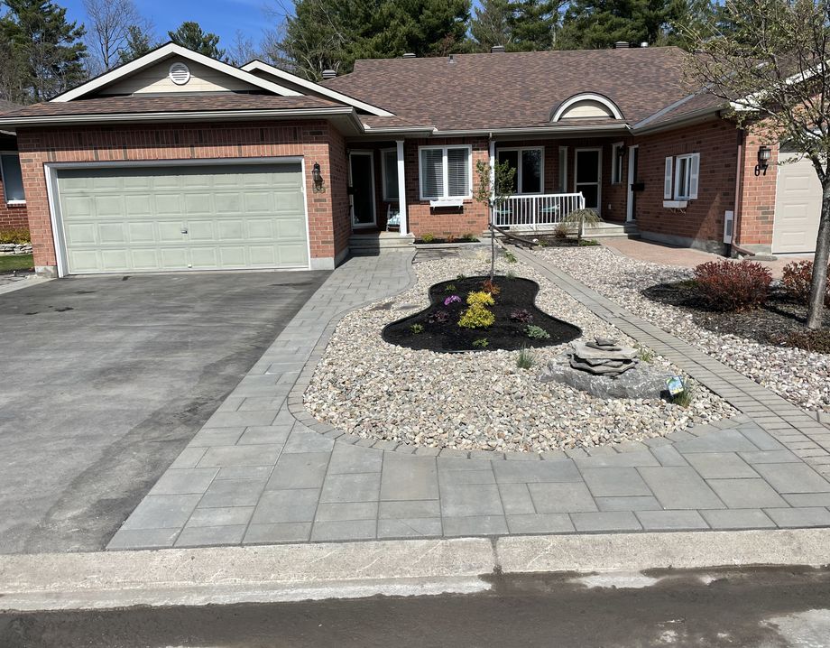 Frontyard with new driveway and stone work