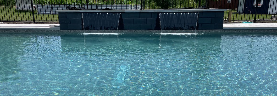 Waterfall going into backyard pool